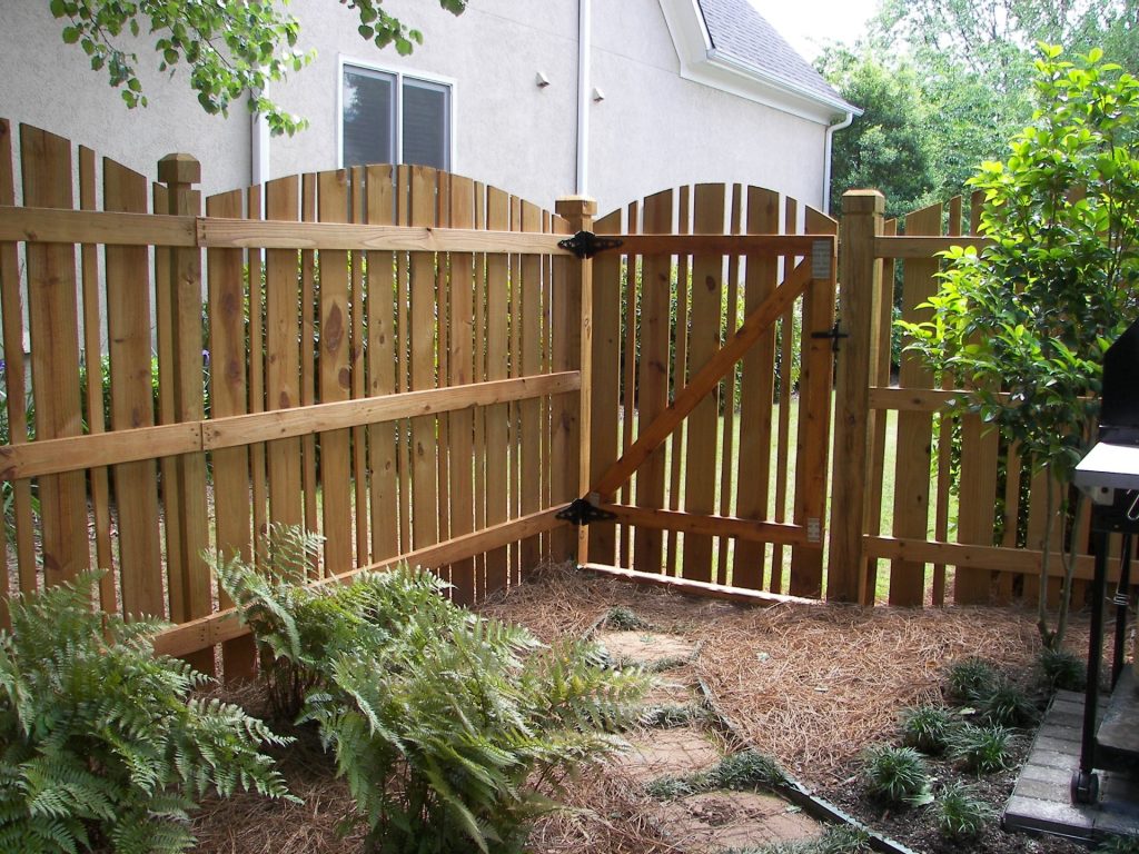 Colonial Scalloped Stained Wood Fence
