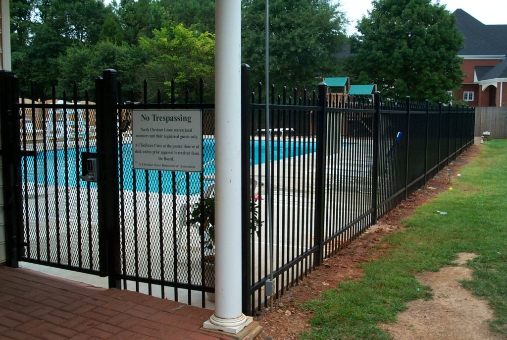 Steel fence with coded lock on gate